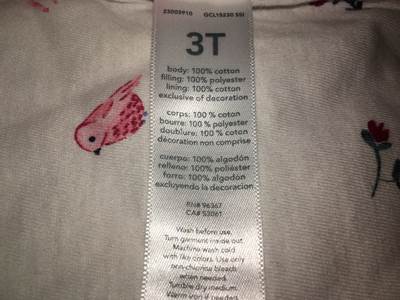 Care tag showing the style number and UPC location.